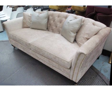 SOFA, two seater, in light gold fabric, button back on turned castor supports, plus four scatter cushions, 90cm H x 100cm D x