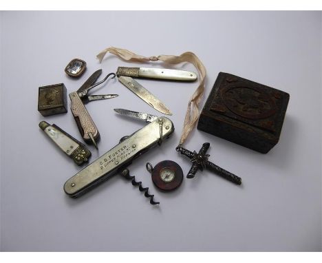 A Gentleman's Lot, including a wood carved stamp box, silver-metal stamp box, glass seal inscribed 'Faith', three penknives, 