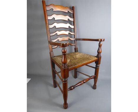 Eight Quality Oak and Rush-Seated Ladder Back Chairs, comprising six dining ladder backs together with two matching carvers.(