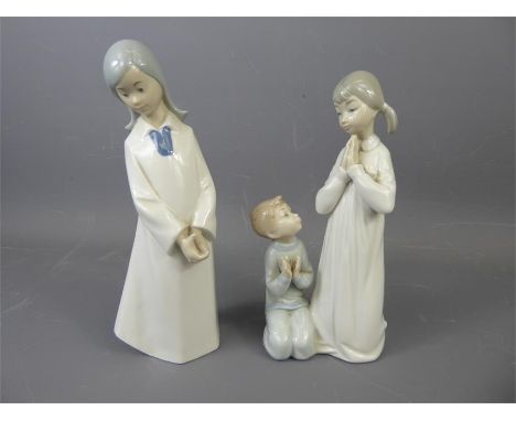 Nao and Lladro Figurines. depicting a figure prayer, approx 20 cms.