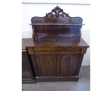 An Edwardian Mahogany Sideboard, with carved gallery. Two double doors, internal shelf, mounted on casters, approx 86 x 44 x 