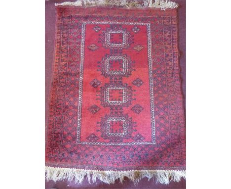 A Persian Wool Burgundy Carpet, Central geometric design with foliate border, approx 143 x 110 cms. .