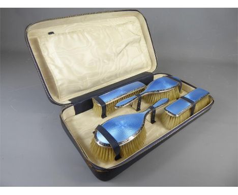 A Vintage Leather Blue Enamel &amp; Silver Vanity Set, twin hair-brushes, two clothes-brushes, mirror and comb, contained wit