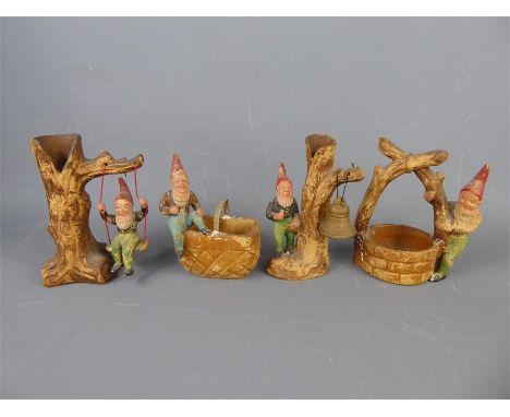 Heissner, Four Terracotta Vintage Art Pottery Gnomes, including a bell-ringer, approx 15 cms high (stick missing), gnome on a