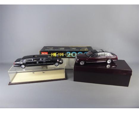 A Minichamps 1:18 Bentley State Limousine, the burgundy die cast car features steering, suspension, wheels and an opening bon
