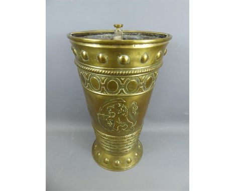 An Antique French Brass Umbrella Stand, the stand with repousse circular stud design, the primary field decorated with repous