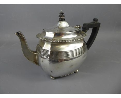 A Silver Bachelor Teapot, London hallmark, dated 1907, mm C.S Harris, the tea pot with ribbed decoration on ball feet with eb