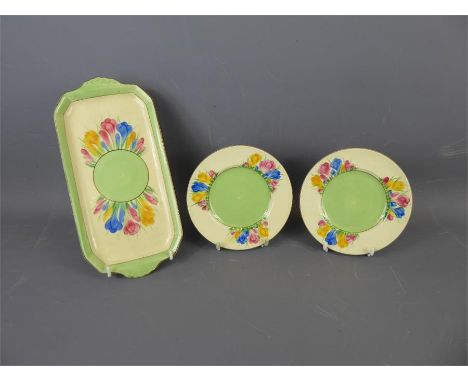 A Clarice Cliff (for Royal Staffordshire) "Crocus" Sandwich Set, comprising sandwich plate and six tea plates. (7)