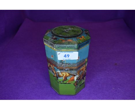 A vintage novelty octagonal shaped Grand National game tin, with lid having a spinning top,which when spun, points to a numbe