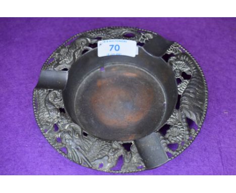 A vintage pewter Japan ashtray having tiger, blossom,chrysanthemums and dragon.