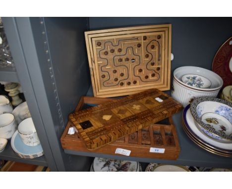 A selection of wooden games and boards including veneer inlayed Cribbage board