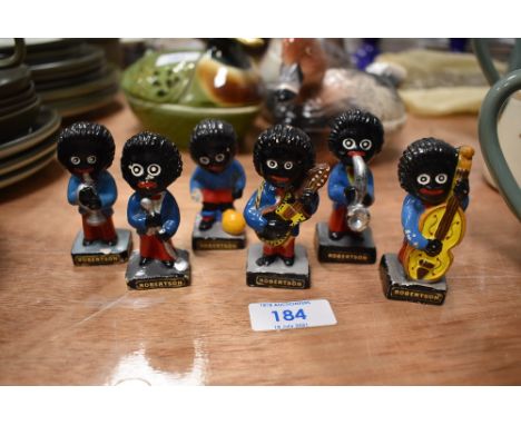 Six vintage Robertsons advertising figures including musicians and footballer