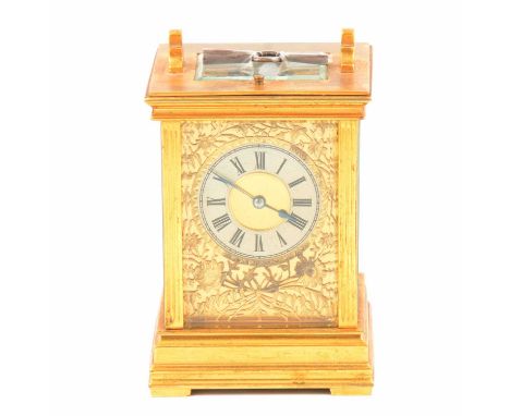 Brass carriage clock, the case with fluted uprights, silvered dial and pierced face, repeating (not working) movement strikin