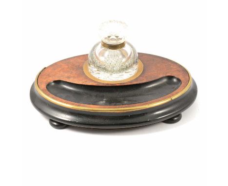 Victorian burr walnut and ebonised desk stand, oval with brass mounts, cut glass inkwell, 29cm.