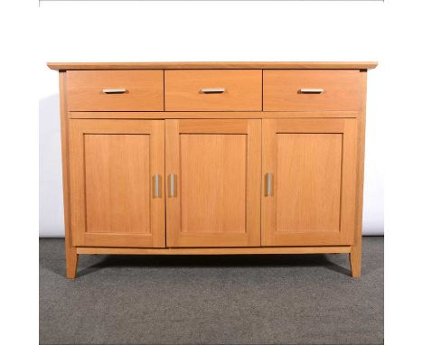 Modern light oak dining suite, comprising sideboard fitted with three drawers and three cupboards, a fold-over table; four st