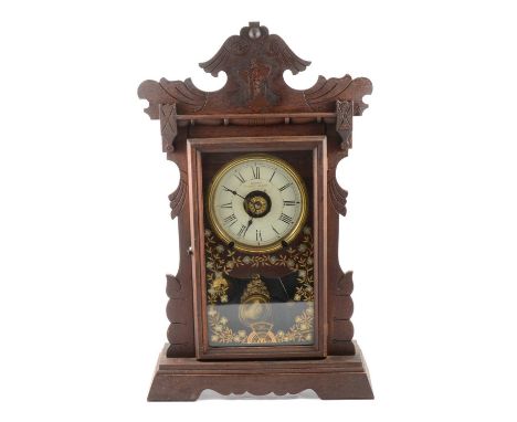 An American stained wood automatic alarm shelf clock by Jerome &amp; Co., Wood's Patent 8-day movement, inverse painted glaze