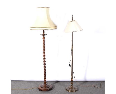 Two standard lamps, including an oak lamp with barley-twist stem, stepped circular base, 153cm excluding fittings and shade; 