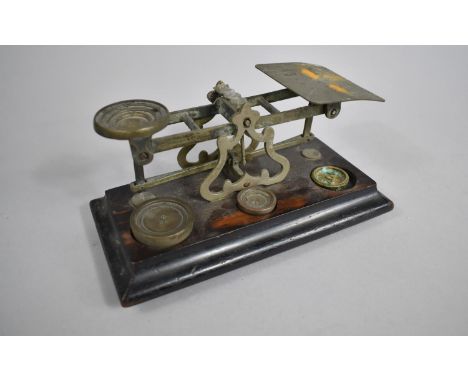 A Set of Edwardian Postage Scales on Stained Wooden Plinth Base having Three Unrelated Weights, 20cms Wide 