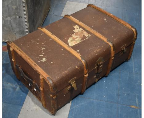 A Vintage Wooden Bound Travelling Trunk with Remnants of Luggage Labels, 75cms Wide 