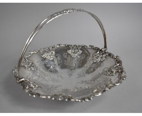 An Edwardian Silver Plated Cake Basket with Hinged Loop Handle, Engraved and Moulded Decoration, 26cms Diameter 