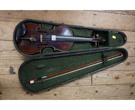 A antique German violin, labelled 'Antonius Stradivarius', with 14in two piece back, with bow and ebonized case. 