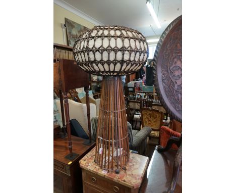 A 1970s bamboo and wicker floor lamp, with fabric shade, 89cm high.&nbsp; 