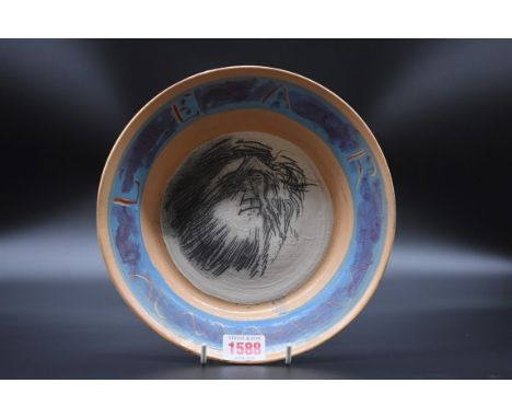 Studio Pottery: Quentin Bell, a portrait plate, titled 'Lear', indistinct impressed marks, earthenware, 22cm high. 