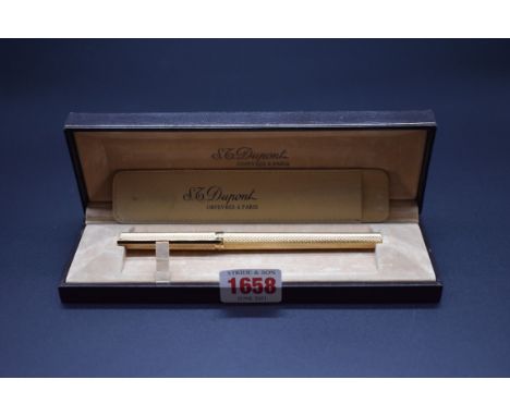 A Dupont gilt engine turned pen,&nbsp;boxed.&nbsp; 