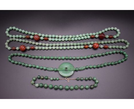 A collection of Chinese green jade bead necklaces.&nbsp; 