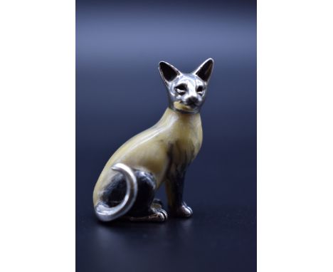 A small enamel and silver mounted Siamese cat, by&nbsp;Mark Houghton Ltd, import mark London, 3.3cm high. 