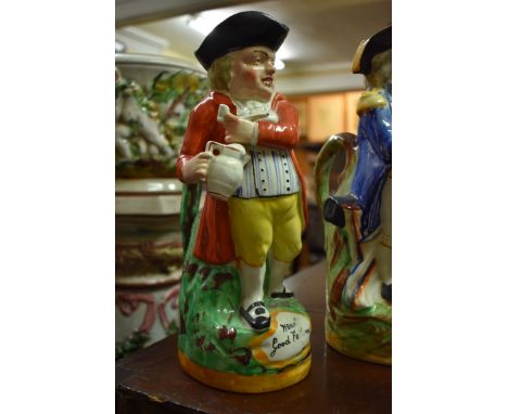 Five Victorian Staffordshire pottery figures, comprising: a large group with harp, 39cm high; another large spill vase; and t