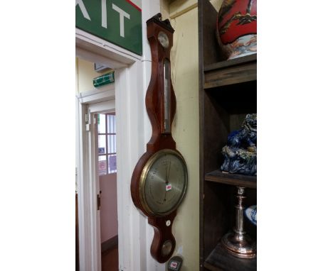 An early 19th century mahogany and inlaid four dial banjo barometer,&nbsp;signed 'Pozzi &amp; Co'.&nbsp; 