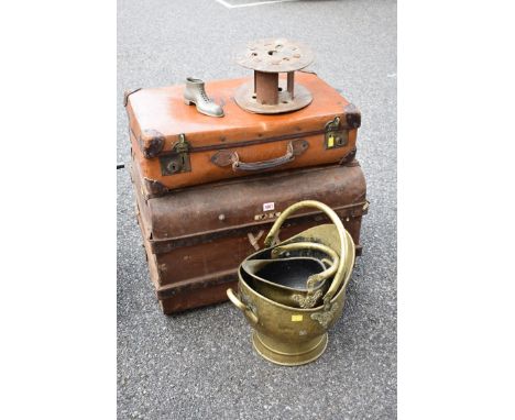 An old tin trunk; together with a leather suitcase, coal scuttle and two small cans and an old stage light.&nbsp;Collection o