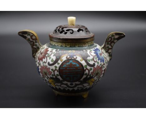 A Chinese cloisonne enamel twin handled tripod censer, 18cm wide, with pierced wood cover and wood stand.&nbsp; 