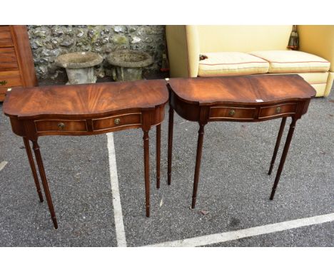 A pair of reproduction mahogany serpentine fronted console tables, 73cm high x 80cm wide x 34cm deep.&nbsp;&nbsp;Collection o
