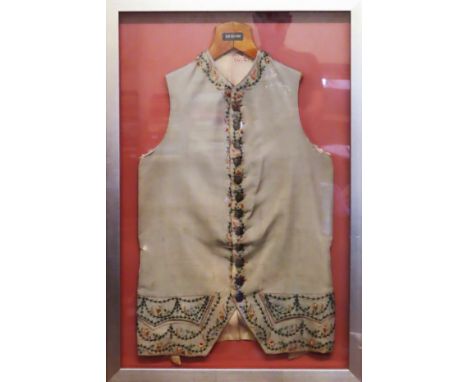 Framed vintage embroidered waistcoat

reasonable used condition 