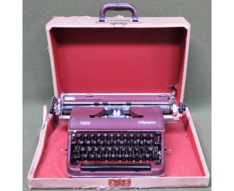 Cased vintage Olympia typewriter

used not tested, box damaged 