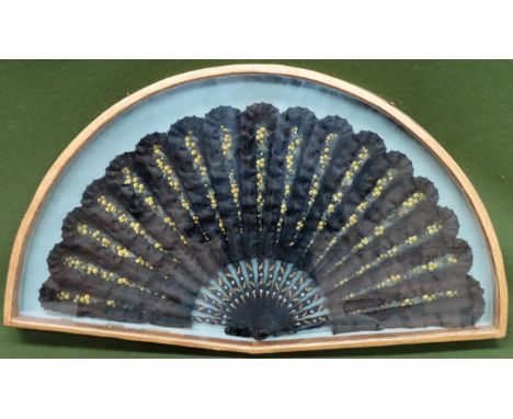 Vintage gilded and glazed display case containing large hand painted, ebonised and gilded hand fanCase Approx. 45 x 78cms

re
