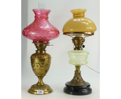 Embossed Brass Postlethwaite Oil lamp and shade together with similar unbranded Uranium glass and brass smaller lamp ( latter