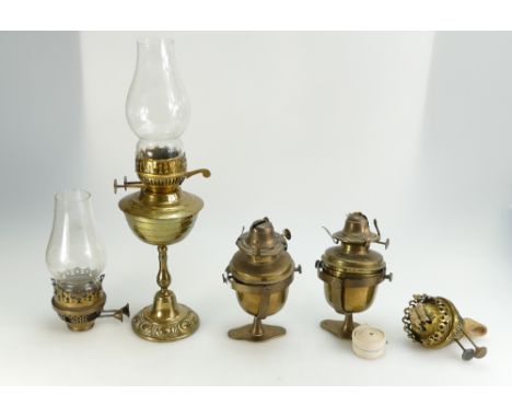 A mixed collection of brass oil lamp mantels and 20th century gimbal type fittings 