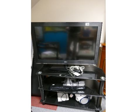 Modern 3 tier TV stand with a 32'' LG TV, Panasonic DVD player, Phillips radio and a video recorder (5)