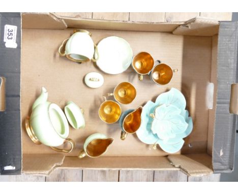 A collection of green and gilt Carlton ware items to include cups, saucers, teapot, etc