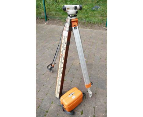 Nikon surveyors automatic level with case and telescopic tripod along with a small set of surveyors staffs (3) 