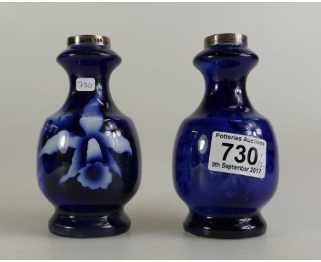 Two small silver topped ceramic vases with deep blue floral decoration (2)