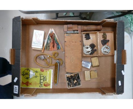 A mixed collection of items to include ARP whistle and matching rattle together with military cap badges, cigarette lighters,
