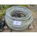 MOD stock Pallet of galvanised razor wire. 1m concertina coils stretches to approx. 40 m