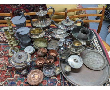 Mixed metalware to include a silver plated tea service, pewter tankards, brass candlesticks and other itemsLocationIf there i