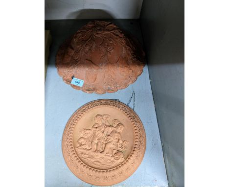 A terracotta ceiling light shade relief decorated with trailing acorn and oak leaves, and heads of French famous 18th and 19t