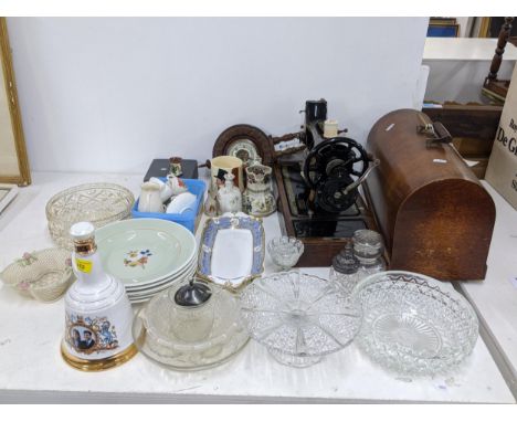 A mixed lot to include, a Singer sewing machine (Y7642041) a barometer, a few items of goss china, a sealed Bell's whisky bel