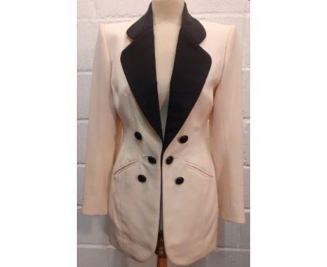 Catherine Walker- A late 20th Century cream tuxedo style longline and fitted wool jacket having black lapels, black buttons a